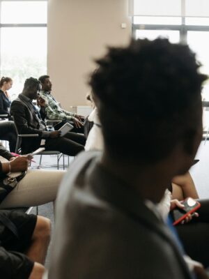 Diverse professionals engaged in an interactive business presentation in a modern conference room.